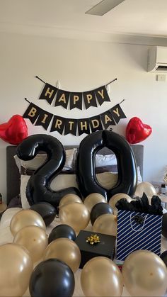 a birthday party with balloons and streamers in the shape of numbers 20, twenty two