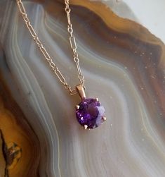 "PD496 Maine Amethyst in 14k rose gold necklace. Round brilliant cut Amethyst is from the famous Fourth of July Amethyst discovery in Deer Hill, Stow, Maine. This stone was mined in 1993 by Intergalactic Mining, it exhibits the classic red-flash of the best Maine Amethysts. Weight of the stone is 1.8ct, dimensions is 8mm. Pendant mounting is 14k rose gold scroll design. Chain is an 18\" 14k rose gold link style with a lobster clasp." Braid Designs, All Gems, Gold Link, 14k Rose Gold Ring, Rose Gold Pendant, Scroll Design, Celtic Designs, Tourmaline Ring, Yellow Gold Earring