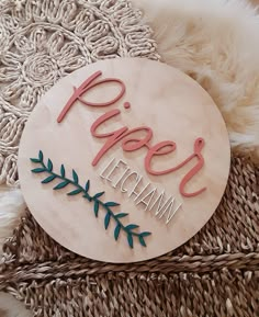 a wooden sign that says peace and the words vietnam on it sitting on a rug