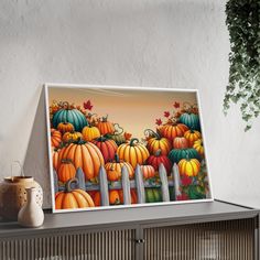 a painting of pumpkins on a shelf next to a potted plant