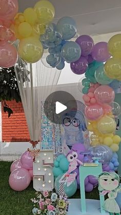 an outdoor birthday party with balloons and decorations