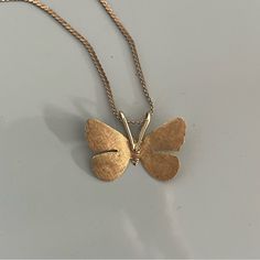 Vintage 14k Solid Yellow Gold Butterfly Pendant With 14k Solid Gold 16” Chain. The Butterfly Pendant Has A Brush Gold Finish, Meaning It’s Not Polished/Shiny. The Chain Has A Polished Finish. The Chain Is 16 Inches Long And Both The Pendant And Chain Together Weigh 3.66 Grams. Pendant Is Marked 14k With An Anchor Symbol And The Chain Is Marked “14kt” And “Italy”. Great, Gently Used Condition. Formal Silver Necklace With Recycled Gold, 14k Yellow Gold Necklace With Butterfly Charm, Formal Necklace With Butterfly Charm Pendant, 14k Yellow Gold Butterfly Pendant Necklace, Formal Butterfly Charm Pendant Necklace, Formal Pendant Necklace With Butterfly Charm, Dainty 14k Yellow Gold Butterfly Necklace, Yellow Gold Butterfly Charm Jewelry For Everyday, Silver 14k Gold Jewelry With Butterfly Charm