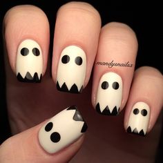 White nails transform into adorable ghost faces with simple black eyes and jagged black tips, mimicking a ghostly sheet. This design is both playful and spooky, capturing the essence of Halloween in a minimalist way. It’s a fun and easy look that adds a touch of whimsy to any Halloween outfit.@mandysnailsx Halloween Nail Art Easy, Halloween Nails Diy, Nail Art Halloween, Holloween Nails, Halloween Nails Easy, Cute Halloween Nails, Masks Diy, Games Diy, Halloween Recipe