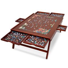 three wooden tables with puzzles on them in the shape of flowers and butterflies,