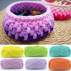 several colors of yarn sitting on top of a basket