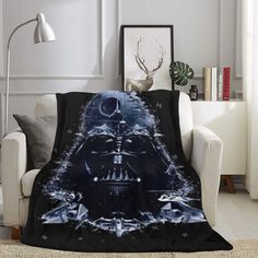 a star wars themed blanket on a couch