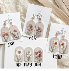 four handmade tags with flowers on them