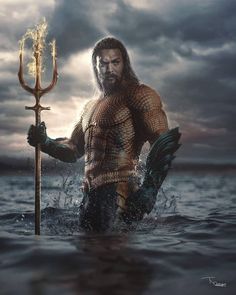 a man in the water holding a spear