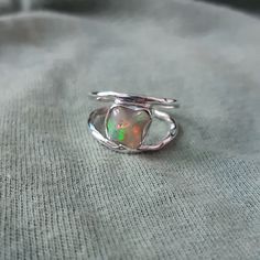 925 Solid Silver Opal Ring, Natural Genuine Uncut Ethiopian Opal Ring, Raw Opal Ring, Opal Birthstone Ring, Gift Ring, Gift For Anniversary, Gemstone:  Natural Raw Ethiopian Opal Metal Purity :- Solid 925 Sterling Silver Stone Shape: Rough  Weight:-   3.5 gm (Approx) Ring Size :- All US Sizes Available This Item Have 925 Stamp Made In: Jaipur, India _._._._._._._._._._._._._._._._._._ DELIVERY TIME:-) Item usually gets delivered within 7 to 15 days, depending on the country and location. _._._._._._._._._._._._._._._._._._ PAYMENT POLICY:-) We accept payment through PayPal only. _._._._._._._._._._._._._._._._._._ FEEDBACK:-) If you like the item and satisfied with our service, once you purchased it, please give us a five stars review. Others should also know that we are giving are best. A Handmade Sterling Silver Opal Promise Ring, Sterling Silver Opal Open Ring, Handmade Opal Rings In Silver, Handmade Opal Silver Rings, Hand Wrapped Sterling Silver Crystal Promise Ring, Silver Spiritual Handmade Ring, Hand-wrapped Sterling Silver Crystal Promise Ring, Handmade Silver Opal Crystal Ring, Silver Hand Wrapped Ring