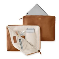 The best gifts are always the ones that make your life infinitely easier - like this beautiful leather clutch that doubles as a super-functional tech organizer. The zip-around closure opens to reveal multiple interior open and zipped pockets, leather tabs, card slots and plenty of space for your phone, keys, cards, cash, chargers, and other daily essentials. Add a foil debossed monogram for a personal touch.    11"w x 1"d x 9"h  Leather or suede exterior with a grosgrain lining.  See Product Inf Camel Bags, Crea Cuir, Everyday Italian, Tas Laptop, Tech Organization, Sac Diy, Sacs Design, Mark And Graham, Leather Card Case