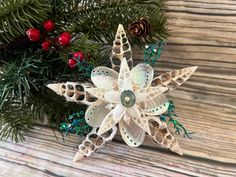 an ornament made out of paper on top of a wooden table