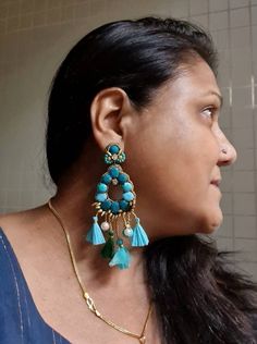 "Handmade statement teal green and turquoise smaller version stunning earrings. Made of handmade fabric cabochons in teal green and turquoise cotton fabric genuinely looks awesome. These handmade earrings are statement indeed. An ideal evening and party jewellery. The earrings measure approx. 3.30\" inclusive of the fringes and 1.75\" wide. This earring is a smaller version of my most popular oversized earring in the store. At Carnation jewellery, each piece is handmade and handcrafted in India, Bohemian Green Chandelier Earrings For Party, Bohemian Green Chandelier Earrings For Festive Occasions, Bohemian Green Danglers For Party, Turquoise Chandbali Jewelry With Latkans, Green Danglers With Latkans, Green Beaded Drop Earrings, Green Dangle Chandelier Earrings With Latkans, Bohemian Turquoise Chandelier Drop Earrings, Unique Turquoise Dangle Earrings