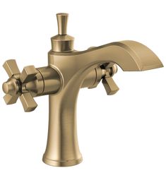 a gold faucet with two handles and nozzles