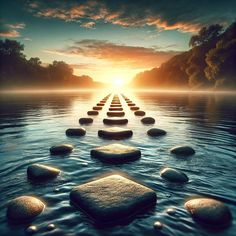 a row of stepping stones in the water at sunset