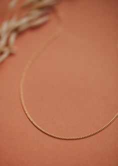 A true favorite around here. We love this dainty curb chain all on it’s own or paired with something a little bolder. Adjustable from 13-15" with a 2" extender. Available in 14kt Gold Fill + Sterling Silver. Juliann pairs it with our Gemma Trio Necklace in Mist. Handmade in Eau Claire, WI. Our jewelry is handmade so each piece will be unique and may vary slightly from what is pictured. Trio Necklace, Adornment Jewelry, Everyday Wear Jewelry, Backdrops Necklace, Zodiac Rings, Hoop Charms, Jewelry Cleaner, Jewelry Case, Curb Chain