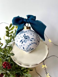 a blue and white ornament sitting on top of a plate