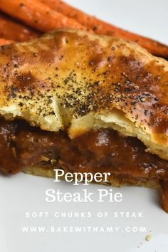 a piece of meat and some carrots on a white plate with the words pepper steak pie