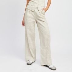 Discover effortless elegance with our Linen Pleated Pants, crafted from 100% linen for an ultra-breathable and lightweight feel. These pants feature a timeless pleated design, adding a touch of sophistication to any look while maintaining a relaxed vibe. Whether you're dressing up for the office or down for a casual day out, these versatile pants will keep you cool and stylish throughout the seasons. Material & Care: Material: Self: 100% Linen / Lining: 100% Cotton Available in: S-M-L Model wear Chic Relaxed Fit Flax Bottoms, Chic Linen Bottoms With Welt Pockets, Tailored Linen Wide Leg Pants For Business Casual, High-waisted Linen Bottoms In Flax Color, High-waisted Linen Bottoms In Flax, Tailored Linen Long Pants, Chic Flax Trousers, Classic Wide Leg Summer Trousers, Business Casual Linen Wide Leg Pants