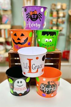 halloween buckets with faces and names on them