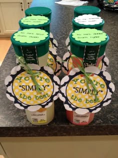 six jars of yogurt sitting on top of a counter