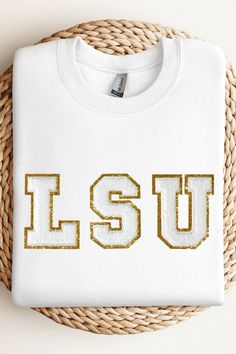 This is a stylish sweatshirt LSU varsity sweater with chenille white and gold sequin fuzzy patch letters. This cute and cozy Louisiana State University chenille letter crewneck varsity sweater for women is extremely soft and pairs well with many wardrobe essentials you already have in your home! You will stand out in the best way possible with this specialty sequin LSU tiger pullover game-day sweater! Lsu Designs, Lsu Svg, Lsu Game Day Outfit, Lsu Sweatshirt, Lsu Outfits, Patch Letters, Lsu Game, Varsity Sweatshirt, Varsity Sweater