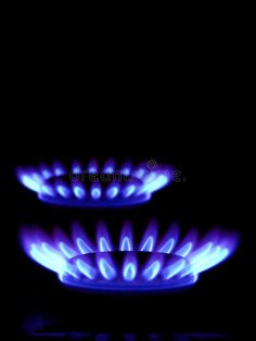 two blue flames on a black background royalty image - free stock photos, images and illustrations