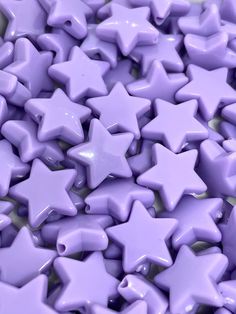 many purple stars are scattered together on the ground