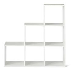 a white bookcase with four shelves on each side and one shelf in the middle