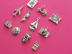 11 Different charms make up this set, ranging from 12 to 22mm. Metal Themed Silver Metal Charms, Nickel Free Silver Themed Charms, Nickel-free Themed Silver Charms, Nickel-free Silver Themed Charms, Silver Metal Jewelry For Travel, Travel Collection, Antique Silver, Cufflinks, United Kingdom