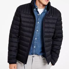 The Perfect Choice For Unpredictable Weather, This Quilted Puffer Jacket From Tommy Hilfiger Offers Lightweight Warmth And And A Packable Design For Effortless Carrying. Imported Two Front Hand Pockets With Zipper Closures Stand Collar; Full-Zip Front Closure Quilted Puffer Styling; Embroidered Logo At Left Chest; Logo Badge At Left Sleeve; Packable Instructions Printed On Wearer's Inner Right Lower Pocket; Packable Bag Included; Lightweight Black Spring Puffer Jacket For Outdoor Activities, Casual Quilted Jacket With Long Sleeves And Zip Fly, Casual Long Sleeve Quilted Jacket With Zip Fly, Casual Black Weatherproof Puffer Jacket, Black Quilted Jacket For Outdoor Activities, Black Quilted Long Sleeve Jacket For Outdoor Activities, Black Quilted Long Sleeve Jacket For Outdoor, Black Long Sleeve Quilted Jacket For Outdoor Activities, Casual Down Quilted Jacket For Spring