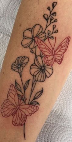 a black and red tattoo with butterflies on it