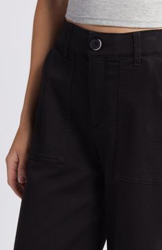 Made with patch pockets for a workwear vibe, these wide-leg pants feature a superhigh waist, deep cuffs and 'Ab'Solution powermesh panels that mold and hold. 26" inseam; 22" leg opening; 11" front rise; 16" back rise Zip fly with button closure Front slant pockets; back patch pockets 77% cotton, 21% polyester, 2% spandex Machine wash, tumble dry Imported Spring Wide-leg Cargo Jeans For Workwear, Black Work Pants With Patch Pockets, Black Cargo Pants With Welt Pockets For Fall, Wide Leg Cotton Workwear Bottoms, Black Utility Bottoms With Welt Pockets, Utility Style Wide Leg Pants With Hip Pockets, High-waisted Wide Leg Pants With Patch Pockets, Trendy Cropped Wide Leg Work Pants, Utility Cropped Jeans For Work