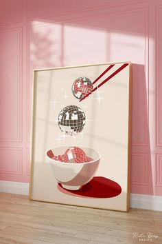 a bowl of food is sitting in front of a pink wall with disco balls hanging from it