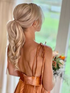 17 Long Ponytail Hairstyle Ideas for Effortless Elegance - thepinkgoose.com Wedding Hair For Bridesmaids Ponytail, Brides Hairstyles Ponytail, Bridesmaid Textured Ponytail, Loose Ponytail Bridesmaid Hair, Bridesmaid Hair Updo High Ponytail, Bride Wedding Hair Ponytail, Mother Of The Bride Ponytail, Updos For Medium Length Hair Wedding Bridesmaid Pony Tails, Up Do Ponytail Wedding