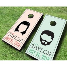 two personalized cornhole game boards on the grass, one is for taylor and the other is for taylor