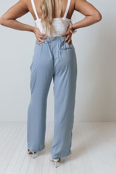 It will surely be a major fashion milestone when you add these chic sky blue pants to your wardrobe with their lightweight flowy material, high elastic waistline with a tie belt, side pockets and a single accent back pocket cut, and a slouched silhouette that falls straight into ankle-length hemlines! Versatile Blue Wide Leg Pants With Pockets, Summer Washed Blue Wide-leg Pants, High-waisted Rayon Pants With Pockets, Straight Leg Rayon Bottoms With Pockets, Rayon Bottoms With Pockets And Straight Leg, Straight Rayon Pants With Pockets, High Waist Light Blue Pants For Loungewear, Light Blue Wide Leg Bottoms For Loungewear, Light Blue Relaxed Fit Bottoms For Day Out