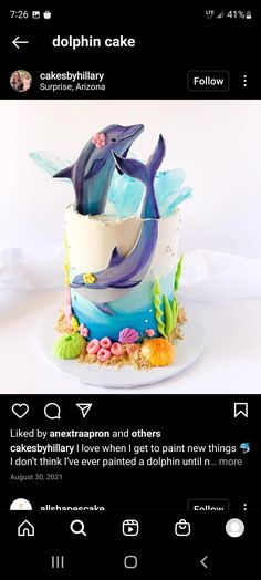 a cake with two dolphins on top of it