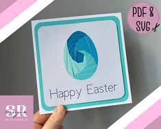 a hand holding up a card with an easter egg on it and the text happy easter