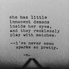 an old typewriter with the words she has little innocent demons inside her eyes and they recklessly play with matches