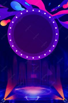 an empty stage with bright lights and colorful shapes on the walls, as well as a circular