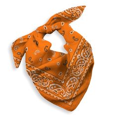 an orange bandana with paisley print on the front and side, sitting on a white surface