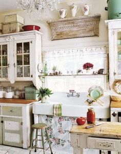 a kitchen with an old fashioned sink and cabinets