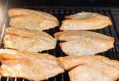 some fish are cooking on the grill and being grilled for dinner or desserts