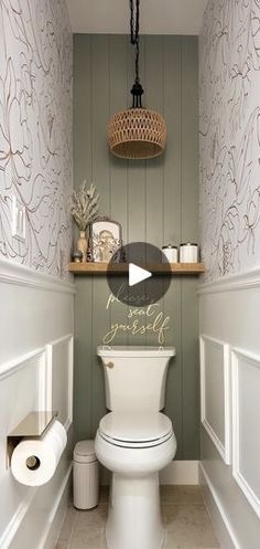 a white toilet sitting inside of a bathroom next to a wooden shelf filled with items