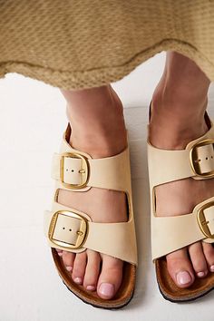 **Fit:** Narrow: A-B Width Classic two-strap style Birkenstock featuring large statement buckles and a distressed look. Genuine leather straps are featured with comfortable, lightweight sole. * Anatomically shaped cork-latex footbed A Birkenstock narrow width fit is comparable to a Medium (B Width). | Arizona Big Buckle Birkenstock Sandals at Free People in White, Size: EU 40 Big Buckle Birkenstock, Birkenstock Big Buckle, Birkenstock Sandals Outfit, Birkenstock Arizona Big Buckle, Arizona Big Buckle, Asia Trip, Buckle Outfits, Sandals Outfit, Workout Outfits