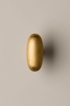 an image of a golden object on the wall