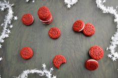 red velvet cookies arranged in the shape of a heart on a table with white stars