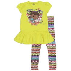 Up For Purchase Is A Brand New/ Nwt Disney's Doc Mcstuffins Shirt And Leggings. The Shirt Is Yellow With Short Capped Sleeves And A Skirted Hem. The Front Of The Shirt Has A Large Heart In A Tribal Print With Doc, Lambie & Stuffy And The Words "Daily Dose Of Caring". The Shirt Is Adorned With Hearts And A Touch Of Glitter. The Legging Have A Striped Tribal Print In Yellow, Pink, Purple And Blue. Playful Fitted Sets With Character Print, Cute Yellow Short Sleeve Clothing Sets, Playful Yellow Short Sleeve Sets, Cute Yellow Sets With Short Sleeves, Cute Yellow Short Sleeve Sets, Cute Yellow Set With Short Sleeves, Yellow Playful Fitted Tops, Playful Fitted Yellow Tops, Fitted Playful Yellow Tops