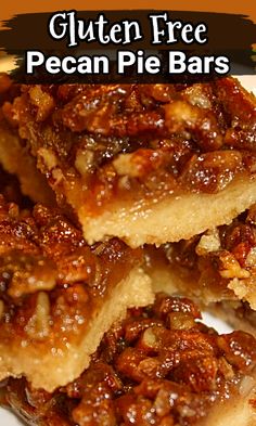 three pieces of pecan bars stacked on top of each other in a white plate