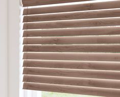 a window with wooden blinds in it